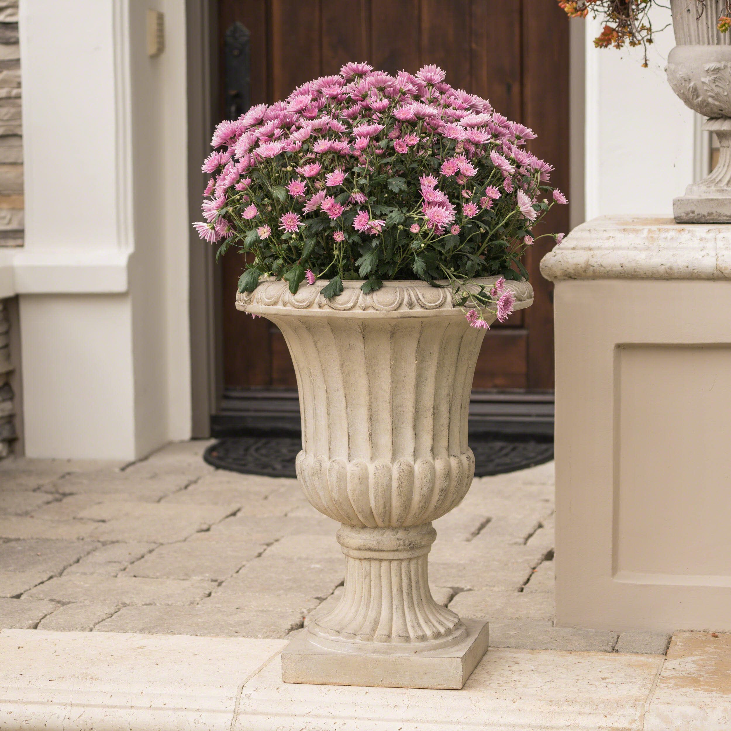 Geffrey concrete urn planter with antique patina finish European garden corner