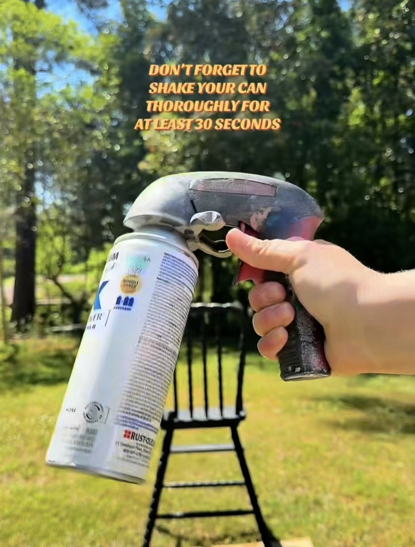 Rust-Oleum Painter's Touch satin spray paint with a Comfort Grip trigger handle attached